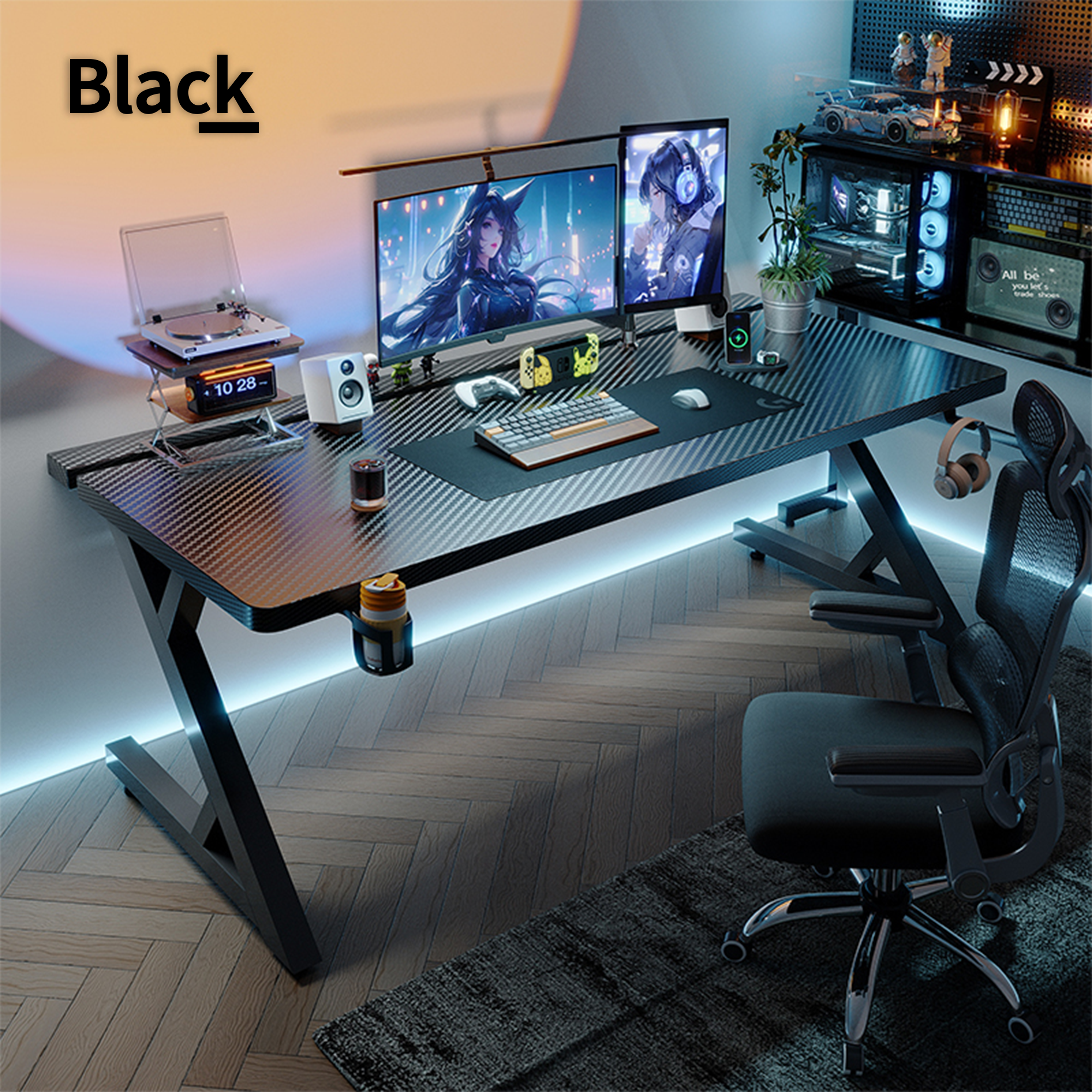 Black gaming desk setup with dual monitors, carbon-fiber desktop, and Z-frame legs in a modern room.