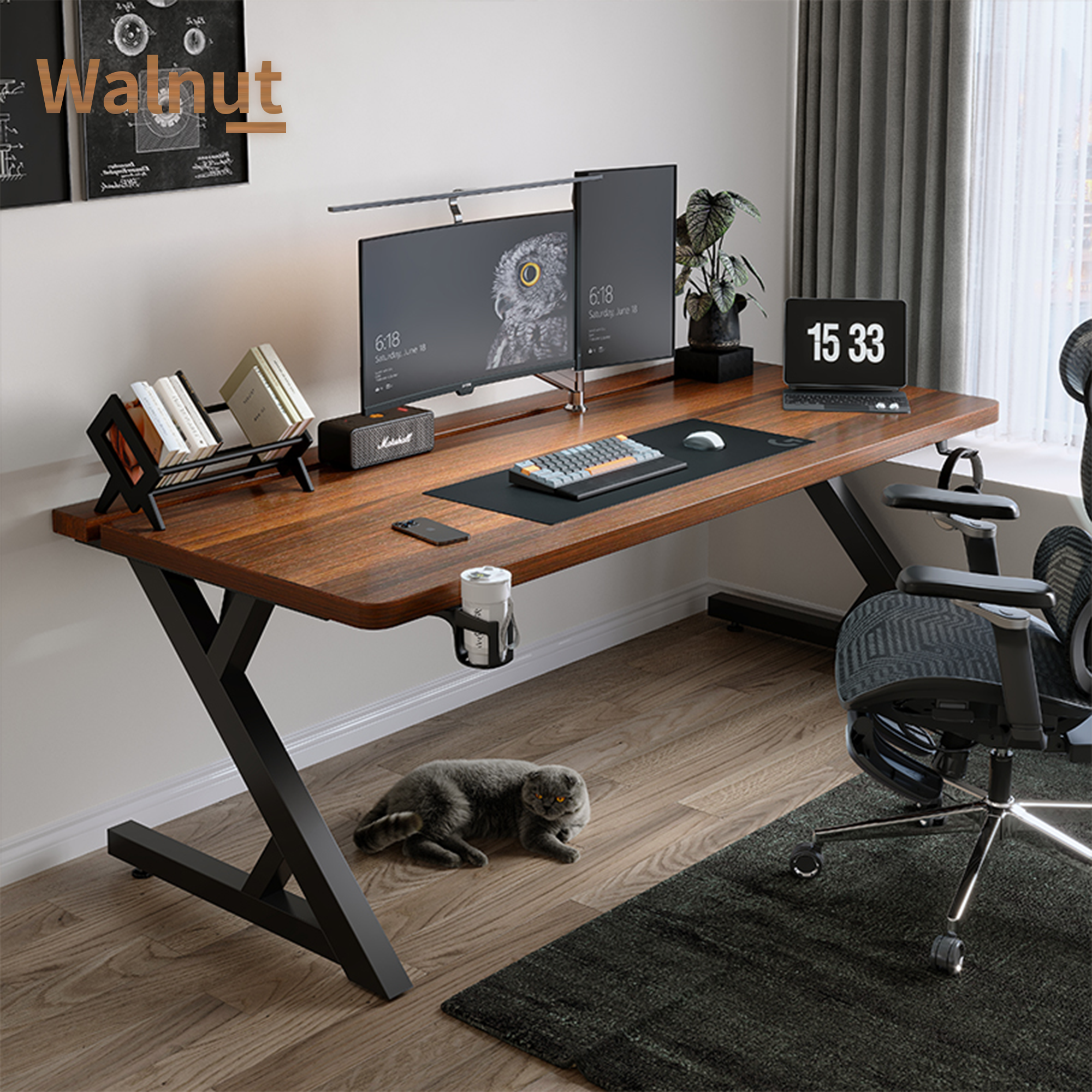 Walnut gaming desk setup with dual monitors and warm wood grain surface for a cozy workspace.