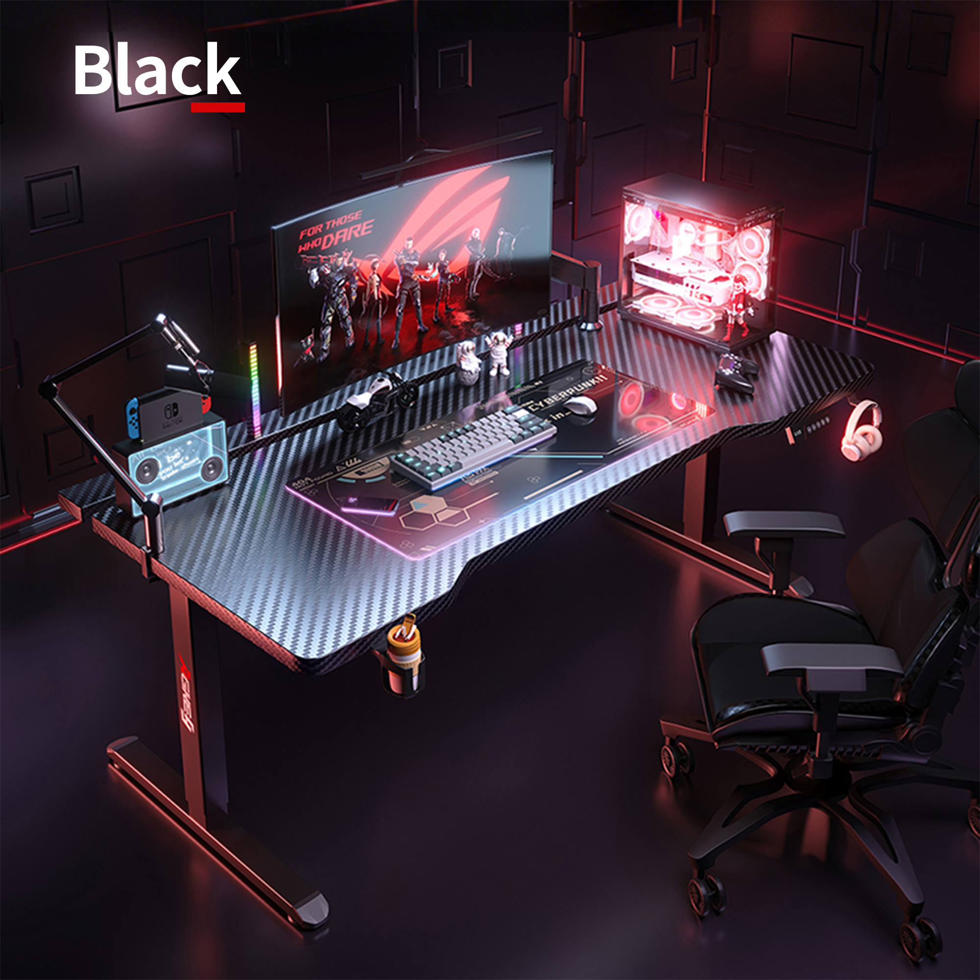 Black K1 electric standing desk with carbon fiber top, featuring a complete gaming setup.
